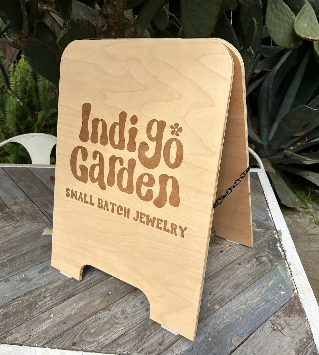 Wooden A-Frame sign for businesses outside on the sidewalk